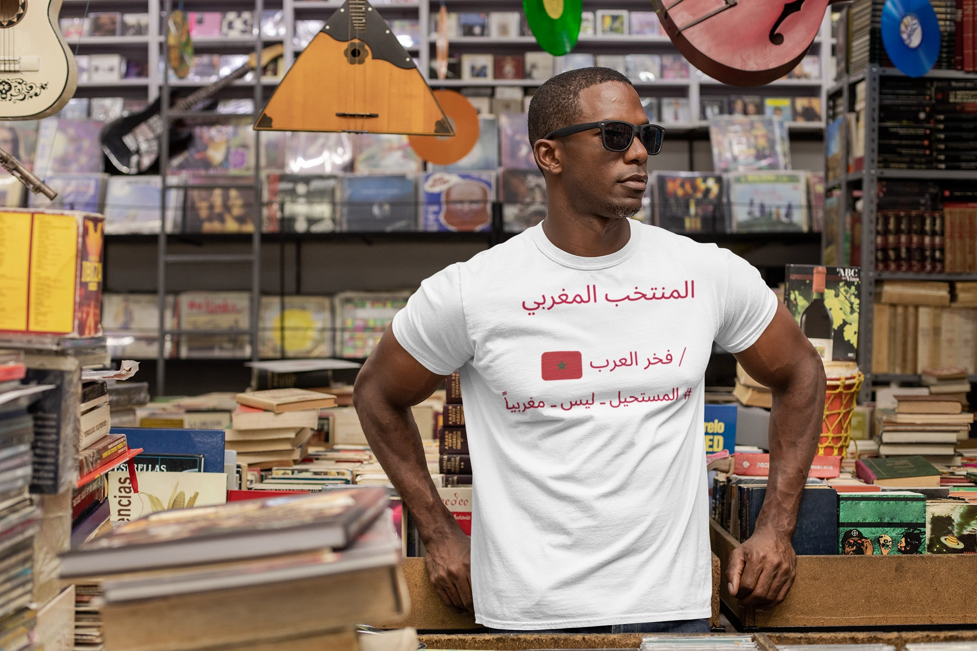 t shirt mockup featuring a man with sunglasses at a vintage records store 30452 | maqwhale  | maqwhale