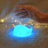 Adorable mini whale night light made of soft white silicone, glowing with a soft and comforting light.