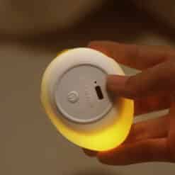 Soft, squishy silicone dolphin night light shaped like a cute dolphin, emitting a gentle and soothing warm glow.