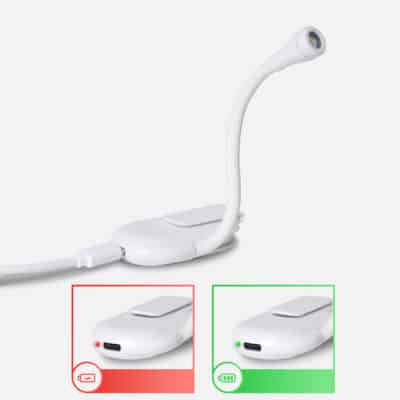 A compact, black clip-on book reading light with a flexible neck and an LED lamp for nighttime reading.