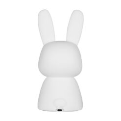 Soft, squishy silicone bunny lamp with long ears, emitting a warm and comforting glow on a bedside table.