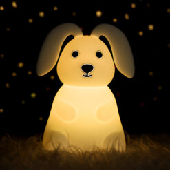 Soft, white sitting bunny night light made of squishy silicone, emitting a warm and gentle glow.