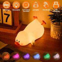 Soft silicone lazy duck night light in a reclining pose, emitting a warm, gentle glow in a dark room.