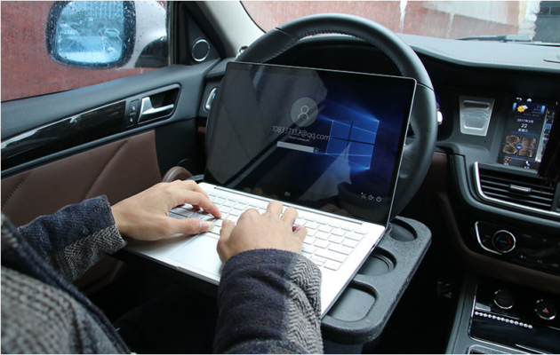 Compact and sturdy car steering wheel desk, ideal for working, eating, or using your laptop while on the move.