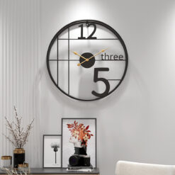 Art 12 to 5 Wall Clock, a modern and artistic timepiece with a creative design, ideal for adding character to any room or office.