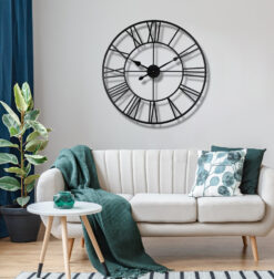 Decorative 80cm metal skeleton wall clock in a distressed black finish, showing the wall through its design.