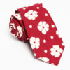 Red flower necktie with a white floral pattern in cotton fabric, offering a fresh, elegant look with a touch of sophistication.