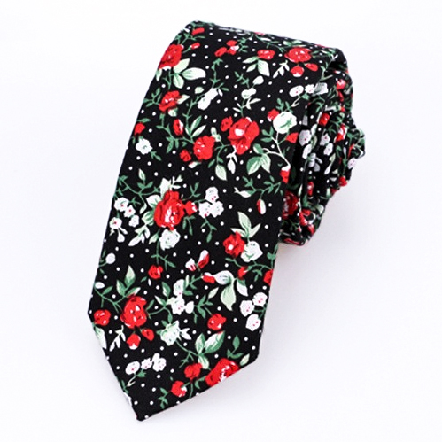 A vibrant red, white, and green floral necktie, adding a bold and stylish touch to any formal or semi-formal outfit.